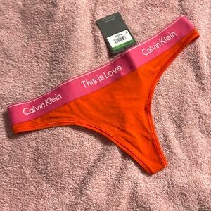 NWT Calvin Klein this is love thong underwear L